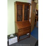 An Art Deco style Oak bureau bookcase, 16" deep x 28" wide x 72" tall.