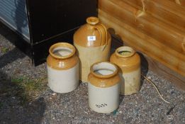 Four stoneware jars.