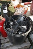 A black bin containing black PVC deep flow and other guttering.