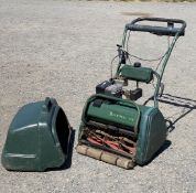 An Atco Balmoral 17s self propelled Petrol Cylinder Lawnmower with grass box and rear roller.