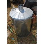 A new metal garden brazier/incinerator with a chimney to the lid.
