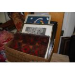 A box of framed pictures, tapestry etc.