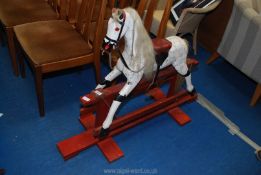 A child's wooden Rocking horse.