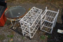 Two white metal shoe racks and a glass topped metal table (a/f).