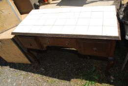 A tile topped sideboard 47" x 22" x 30".