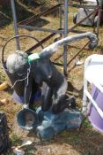 A composite garden fountain 'woman kneeling', approx. 24" tall (spout emerging from vessel).