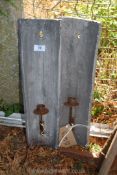 A pair of ceramic and metal candle wall sconces.