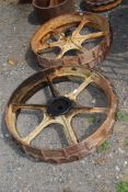 A pair of cast iron 6 spoked wheels, 32" diameter approx.