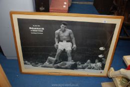 A large framed poster of Muhammad Ali, 40" x 29".