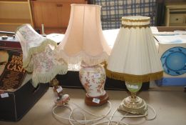 Three table lamps with shades plus a spare shade.