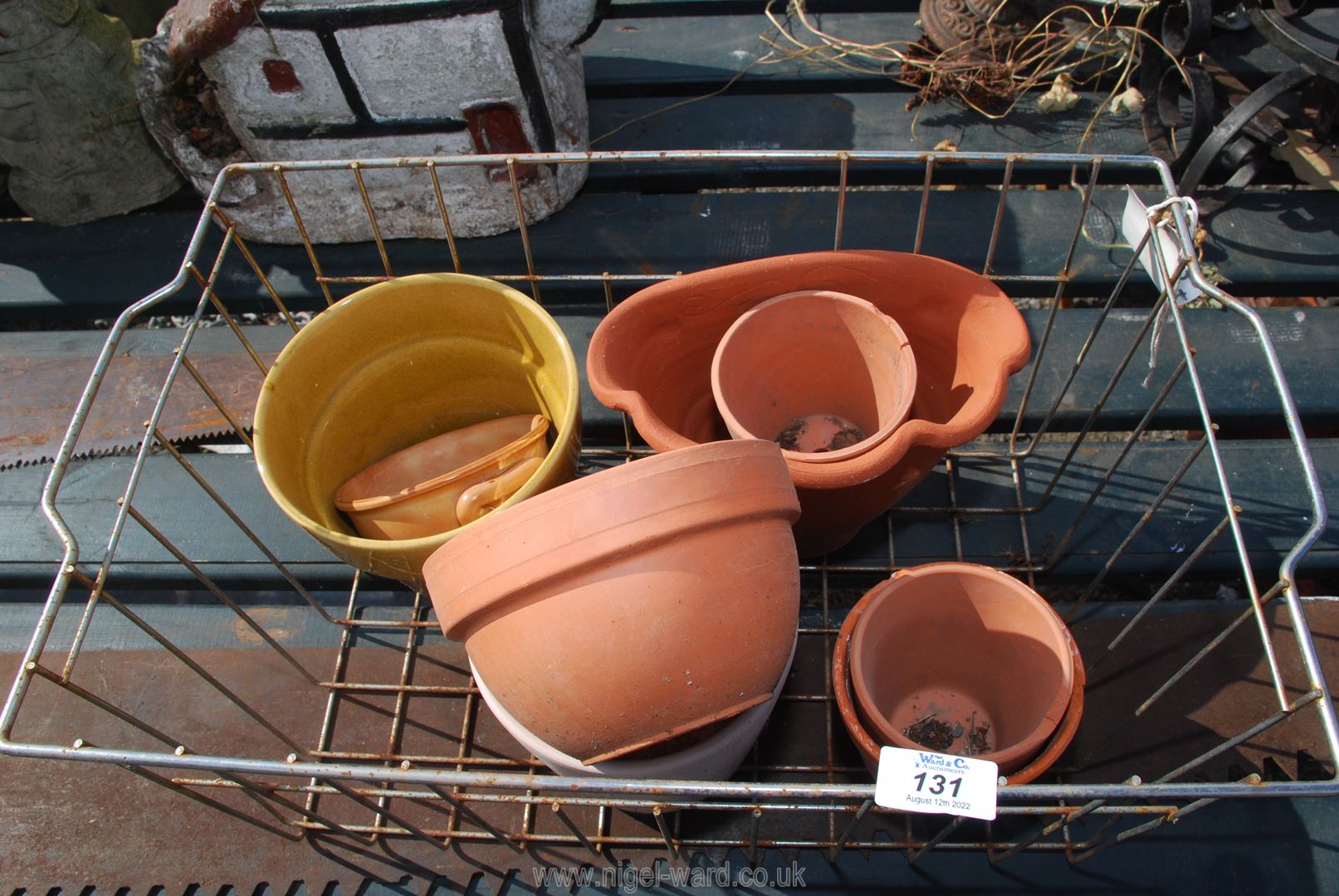 A basket of pots and planters.