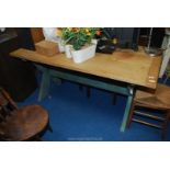 A bleached oak topped Tavern style table with rustic cross braced legs,