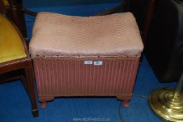 A Lloyd Loom style storage seat by Sirrom.