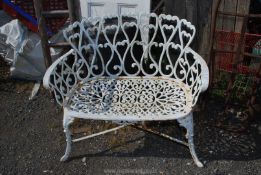 An ornate cast iron garden bench 37" wide x 33" high (16" seat height).