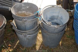 Eight small vintage galvanised buckets.