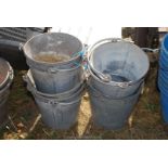 Eight small vintage galvanised buckets.