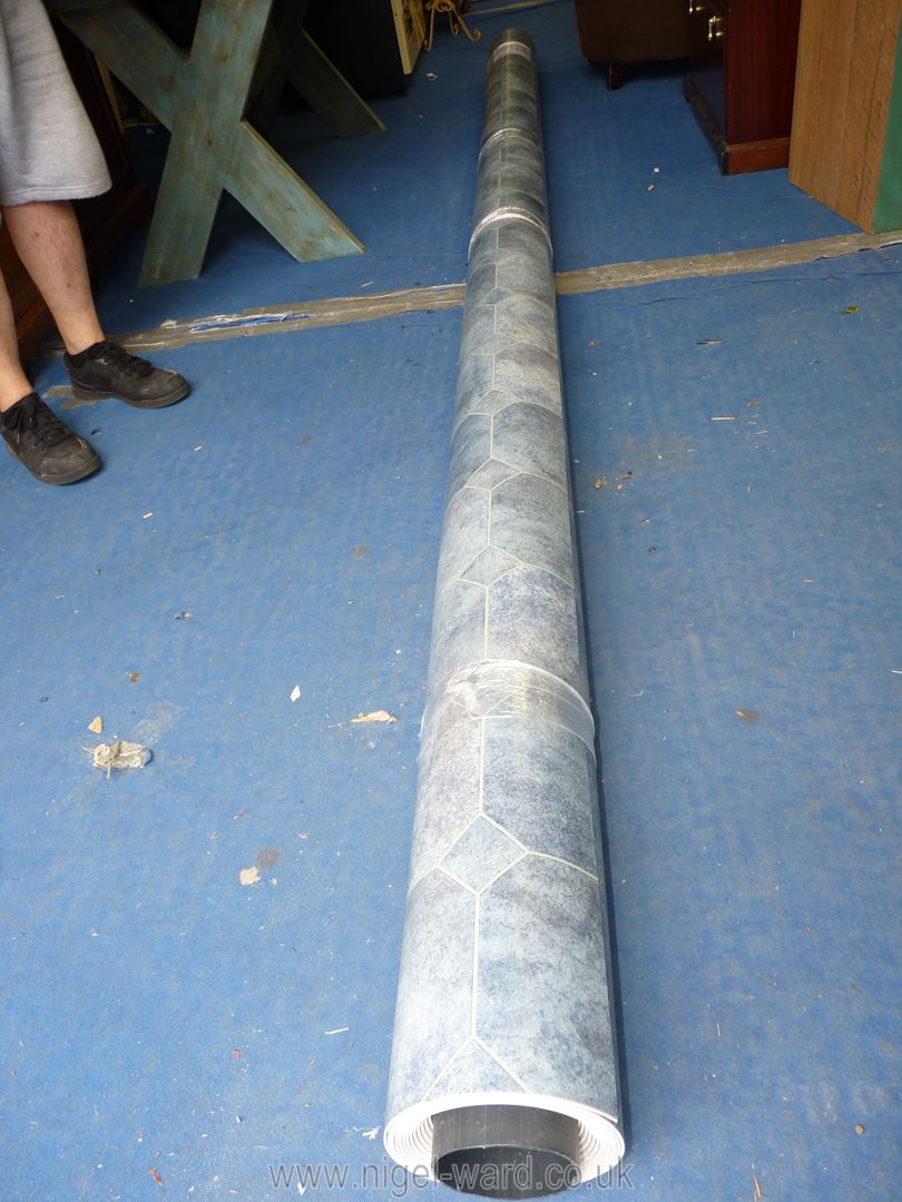 A roll of Blue tile pattern vinyl flooring, 5.25 m x 4m.