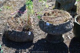 Two concrete planters, an urn 12" diameter x 13" tall and a corner planter 16" diameter x 7" tall.