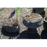 Two concrete planters, an urn 12" diameter x 13" tall and a corner planter 16" diameter x 7" tall.