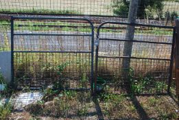 A pair of metal driveway gates with hinges, 98" opening x 44" high.