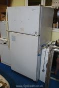A large fridge-freezer ,30" x 30" x 65" high.