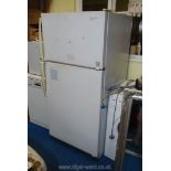 A large fridge-freezer ,30" x 30" x 65" high.