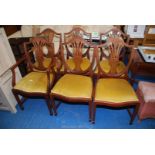 A set of six reproduction dining chairs including 2 carvers.