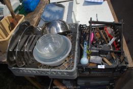 Two crates of kitchenware including utensils, mixing bowls, etc.