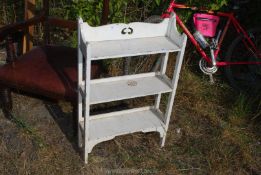 A white painted free standing shelf unit, 21 1/2" wide x 35" high x 8" deep.