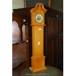 A miniature model clock in the form of a Grandfather clock (battery operated), 31 3/4'' high,