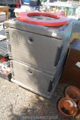 A large Cambro wheeled ice box food cooler 27" x 31" x 45".