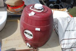 A plastic large brewing barrel with tap suitable for home brewing.