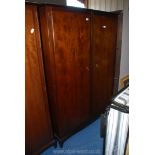 A darkwood double wardrobe, 48" wide x 70" high x 22".