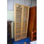 An Ikea 5 shelf glazed bookcase, 12" deep x 31" wide x 79" tall.