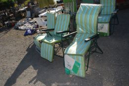 Three reclining garden chairs.