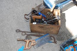 A wooden cartridge box containing hand tools, saws, plane, etc.