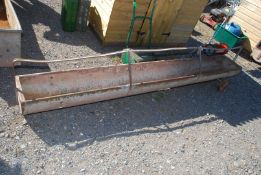 A sheep trough on wheels, 9ft long.