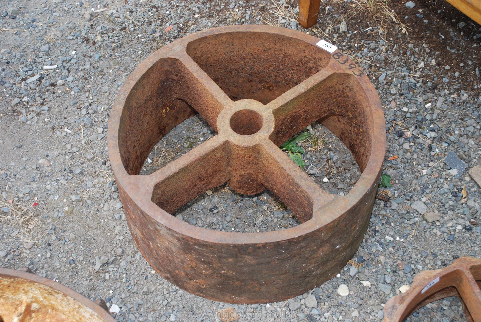A large cast iron drive/fly wheel 20" diameter x 9 1/2" high.