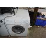A Miele washing machine, (door handle a/f).