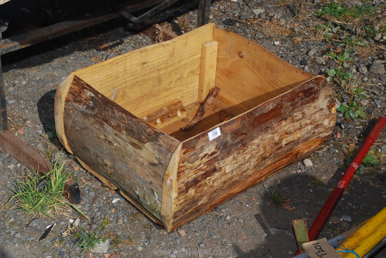 A large rustic wooden planter 24" x 13" x 17".