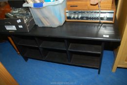 A black coffee table, with shelves under, 47" x 23" x 21".