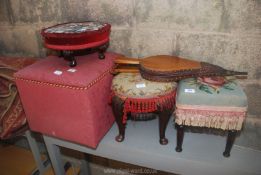 A pair of bellows, tapestry top stools and a small Ottoman.