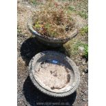 A round concrete planter 9" tall x 19" diameter and concrete bird bath top 16" diameter.