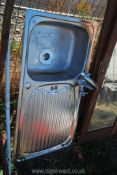 A Leisure stainless steel sink and drainer including taps 20" x 37 1/2".