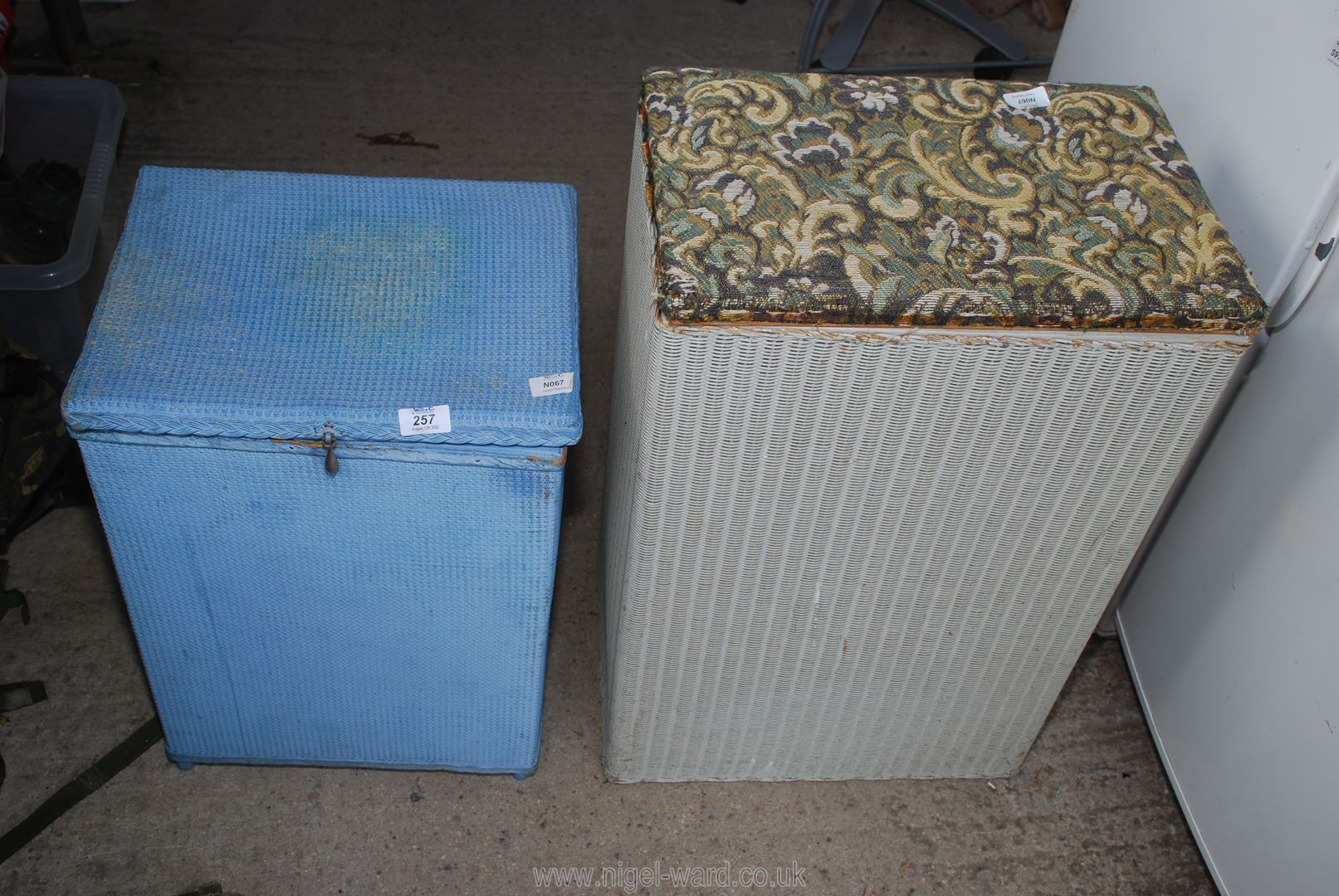 Two Lloyd Loom style laundry baskets.