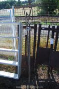 A vintage wooden hay rake and pitch fork.