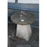 A concrete staddle stone, 20" x 17".