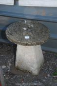 A concrete staddle stone, 20" x 17".