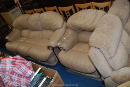 A cream three seater leather sofa and matching chair.