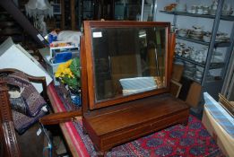 A Mahogany framed Swing mirror with long lift top glove box underneath and inlay banding.